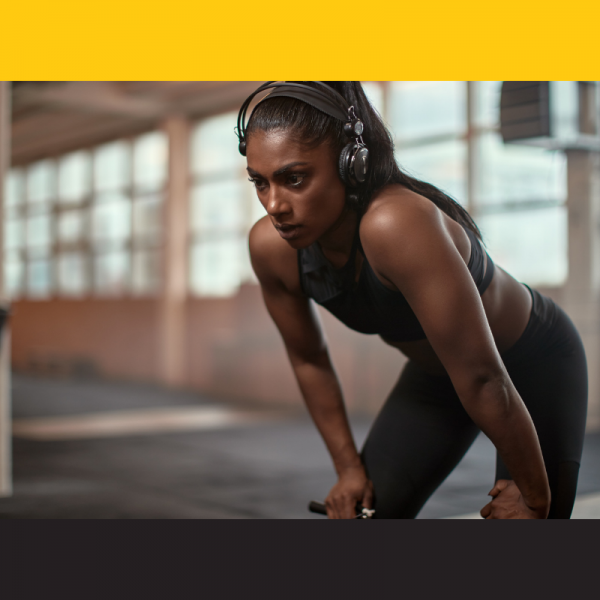 Woman looking focused in the gym between sets